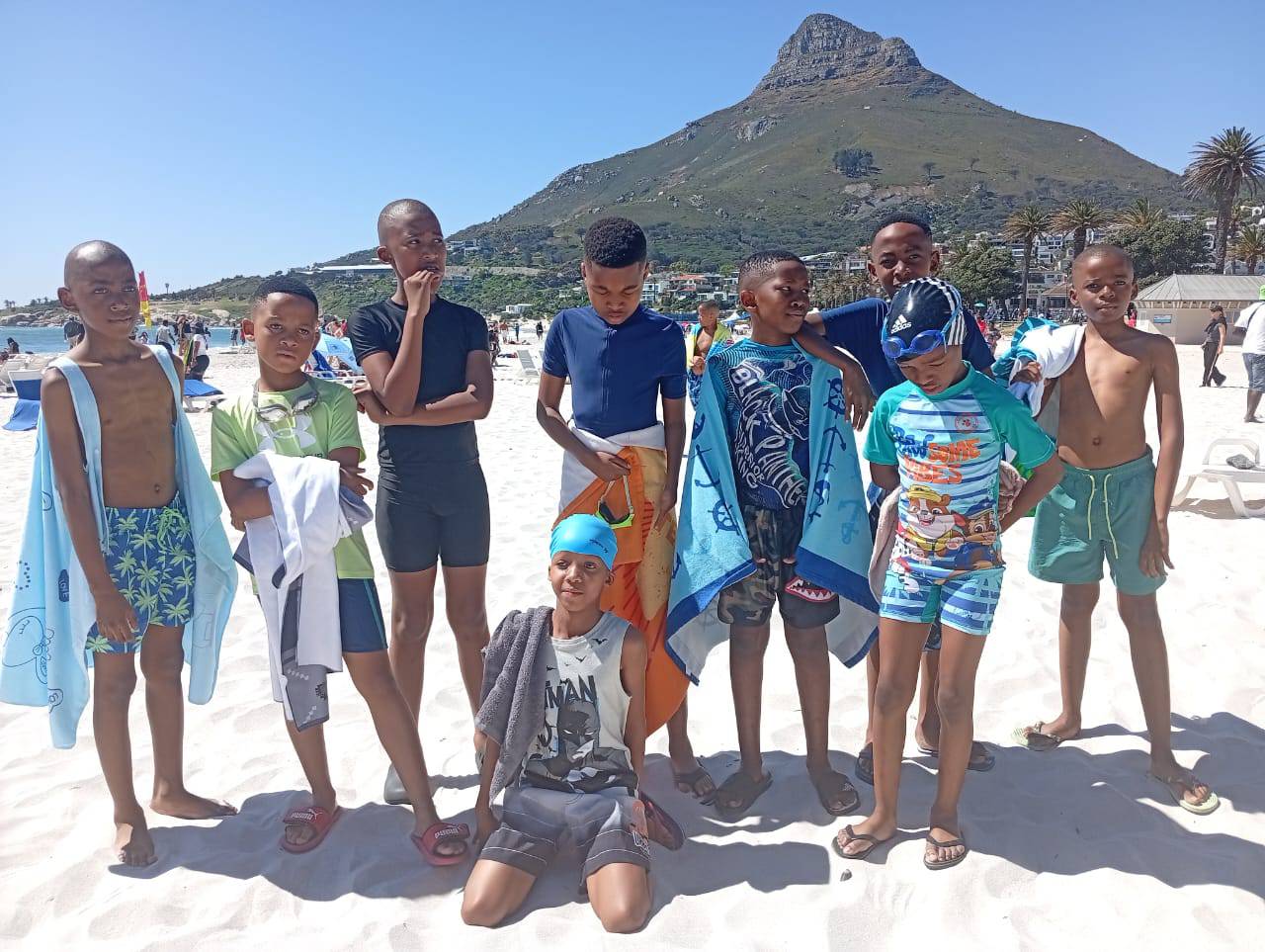 Highridge learners at Camps Bay beach with Lion's Head in the background